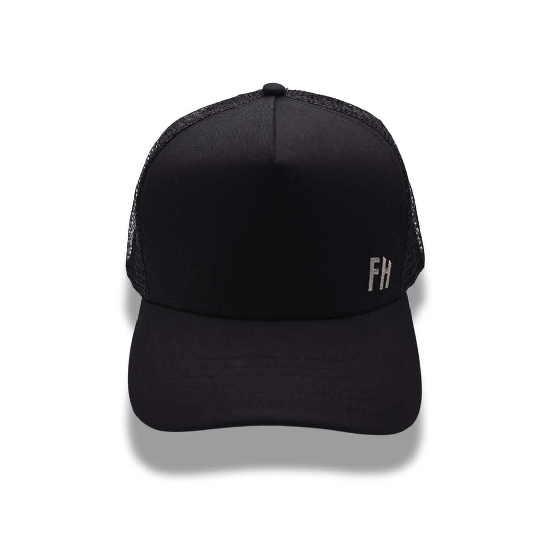 Front photo of the Black XL Trucker Hat for Big Heads by Free Heads.