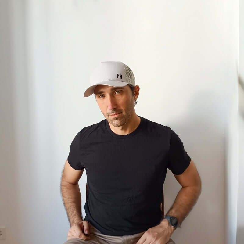 Front-facing model with the Grey XL Trucker Hat for Big Heads by Free Heads.