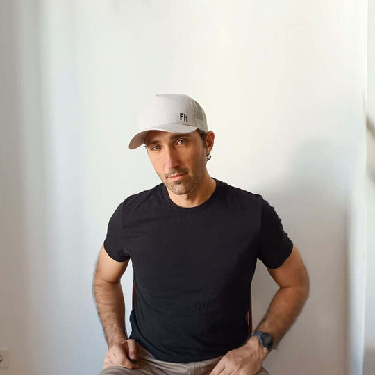 Front-facing model with the Grey XL Trucker Hat for Big Heads by Free Heads.