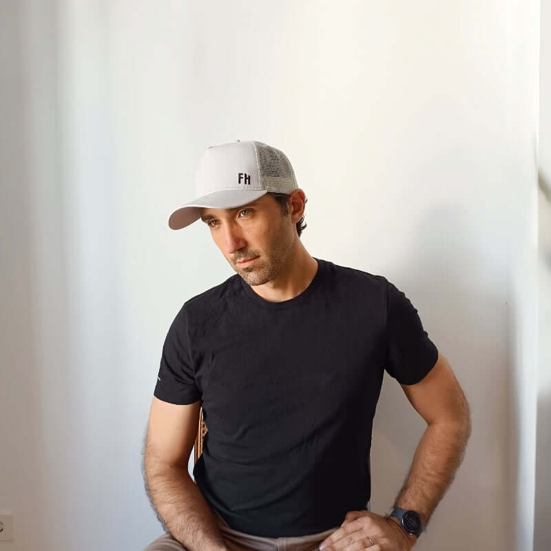 Model wearing the Grey XL Trucker Hat for Big Heads by Free Heads.