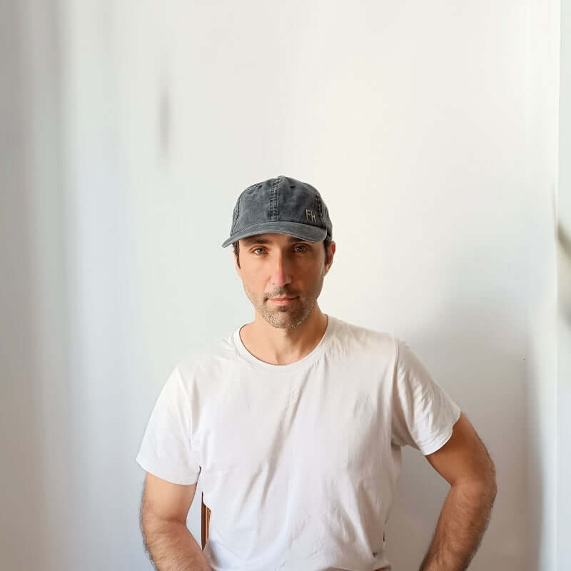 Front-facing model with the Black Cotton Dad Hat by Free Heads. XL Cap for Large Heads.