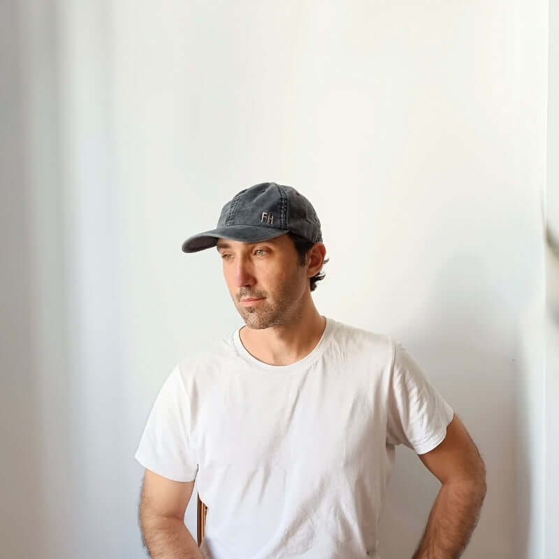 Model wearing the Black Cotton Dad Hat by Free Heads. XL Cap for Large Heads.