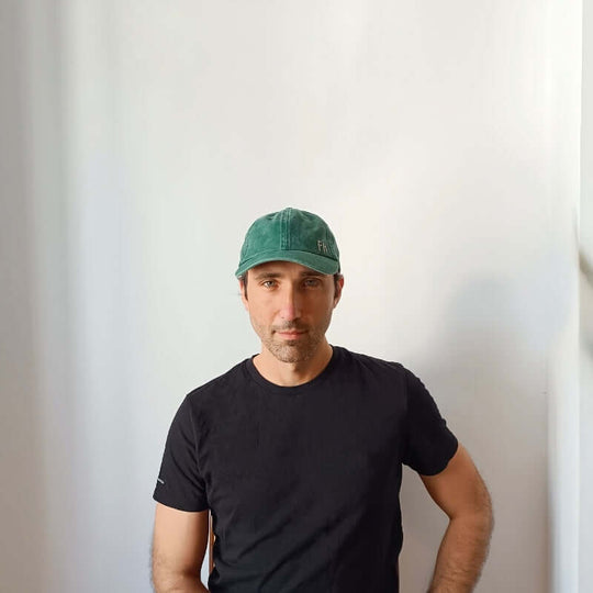 Front view of model wearing the Green Cotton Dad Hat by Free Heads. XL Cap for Large Heads.